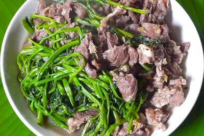 Stir-fried buffalo with water spinach